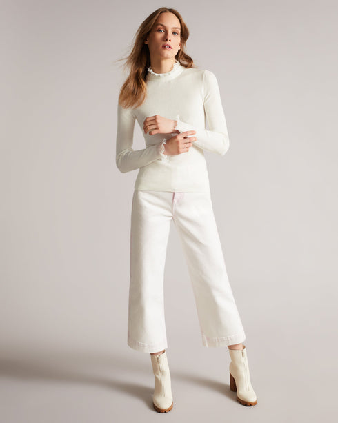 DVANA-Knitwear-For a frilling addition to your smart-casual wardrobe, add DVANA to your style repertoire. Not any ordinary knit, this ribbed jumper is given a little extra in the form of a frill detailing on the neckline and sleeves. Fitted jumper Cashmere blend High neck Long sleeves Frilled trims Ribbed knit- Ted Baker Romania